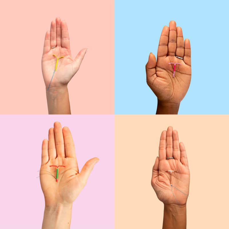 Photo of four IUDs in four hands